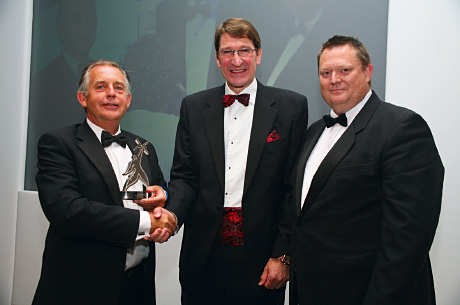 23b_1012 Endoline’s Alan Yates, left, and operations director Garry Powell accept the award from Chris Buxton, of the PPMA.