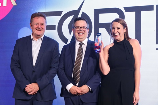 Fortress sales director Phil Brown and marketing manager Leonie Brown collect the trophy from Automate UK chairman James Causebrook