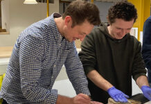 Macfarlane Packaging employee inspires next generation of designers Paul Bynoth talking to a design student at Bath Spa University