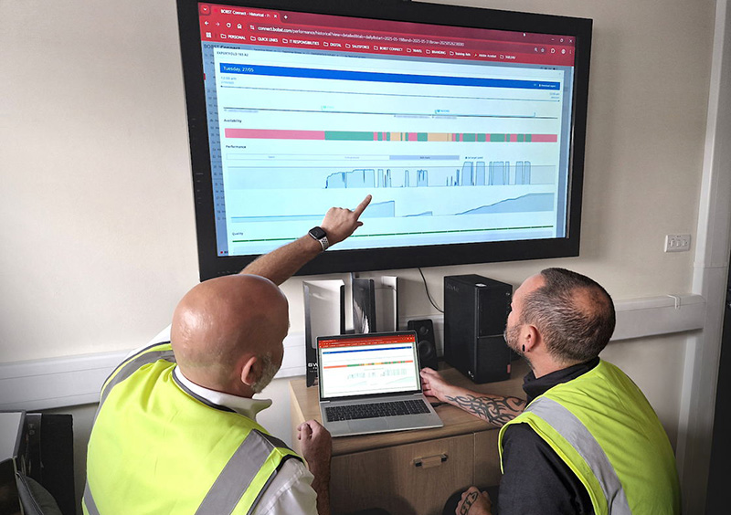 Operatives study packaging machine data