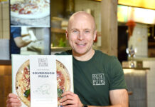 Roly Simpson, East Pizzas shows off the packaging