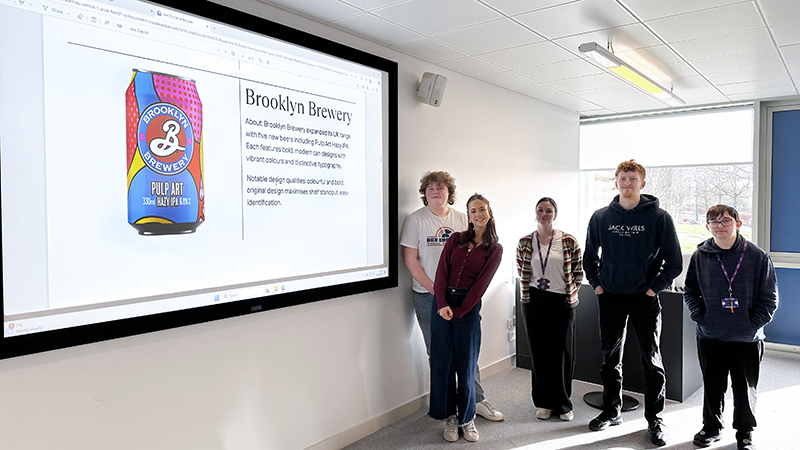 Students with image of Undergraduate Can of the Year award winner