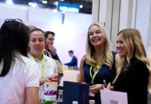 Refillable packs help cosmetics sector to address waste challenge Women at trade show surrounded by cosmetics packaging