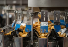Ishida weighers help improve accuracy and reduce giveaway of crackers Multihead weigher with crackers