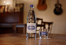 Mineral water brand opts for tamper evident closure solution Mineral water in glass bottle