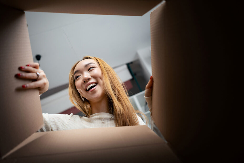 Consumer opening a box. Unboxing image