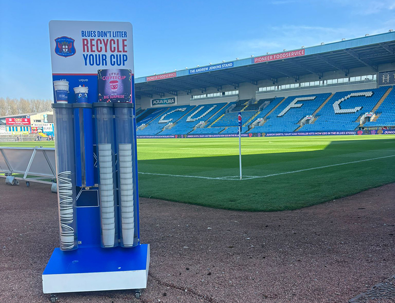 coffee cup collection inside football stadium